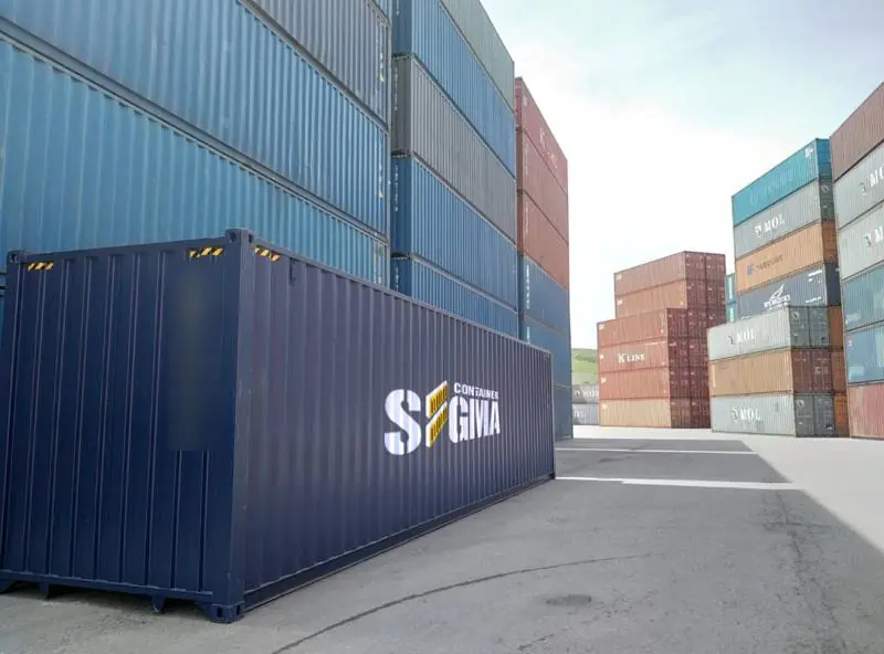 Navy blue 40 foot container with Sigma logo in a port yard